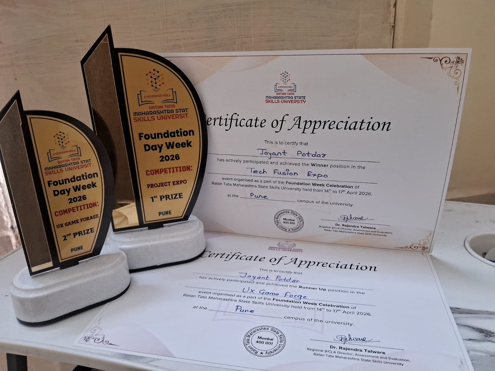 Physical trophies and signed certificates awarded to Jayant Potdar at MSSU